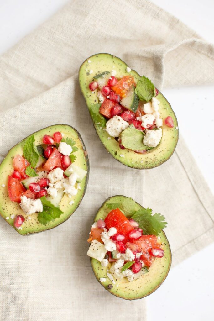 avocados stuffed with cheese and tomatoes